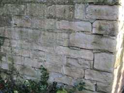 Close up of masonry towards the bottom of the wall of Tanfield Hall November 2016